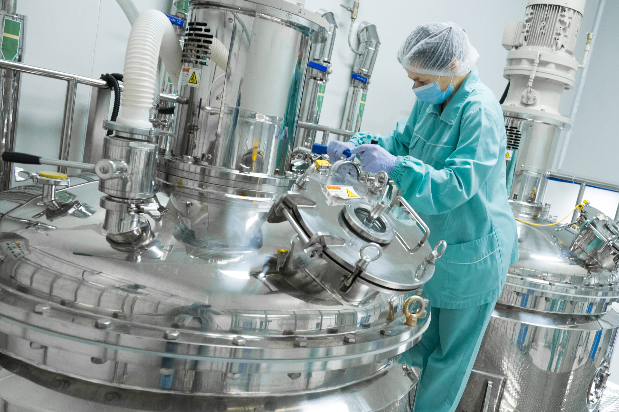 Pharmaceutical technician in sterile environment at pharmacy industry